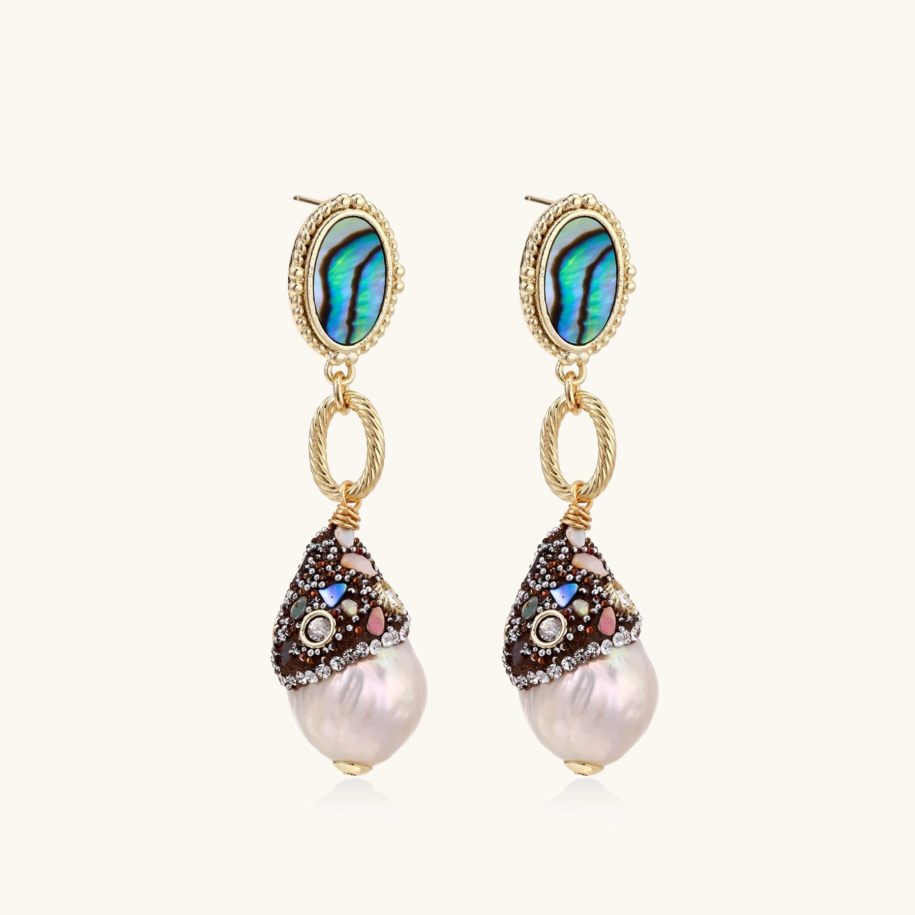 Gold-plated statement earrings with iridescent abalone shells, rope chain links, and crystal-capped baroque pearls