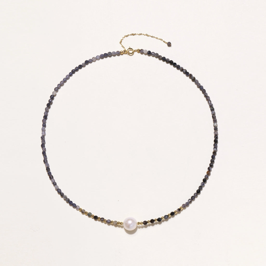 Dainty necklace with faceted purple iolite beads, gold vermeil accents, and central pink-white freshwater pearl.