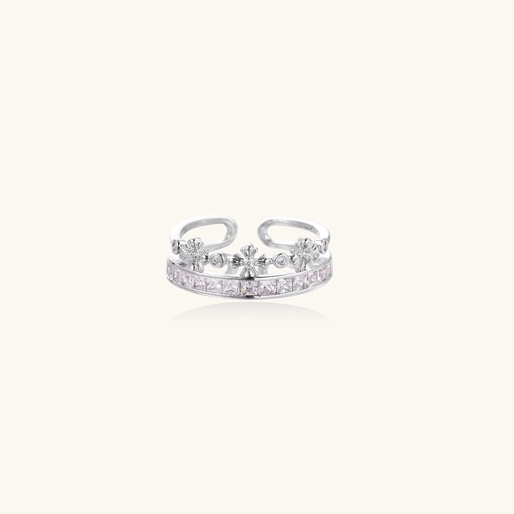 Adjustable gold-plated crown ring with zirconia crystals in ornate tiara design on white background.