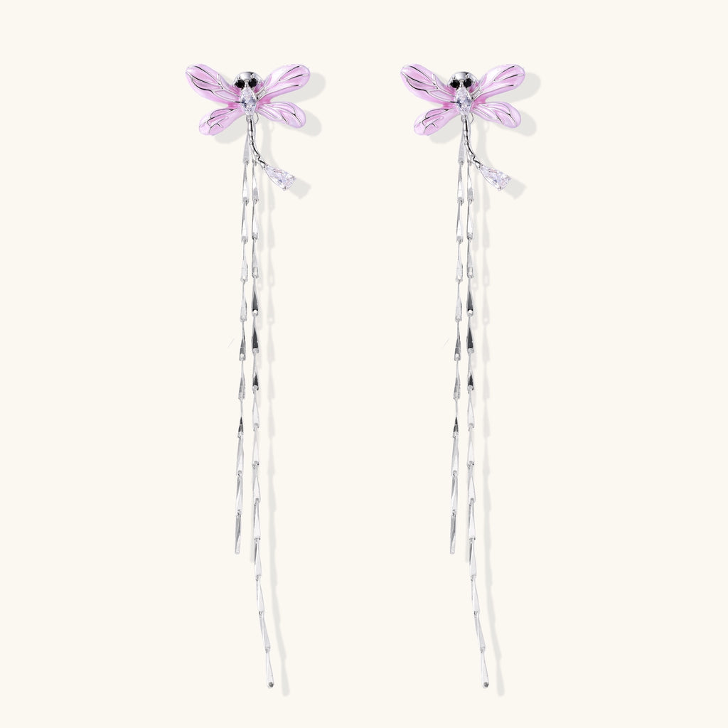 Long dangle earrings with purple dragonfly charms and crystal chains on white background, gold-plated finish.