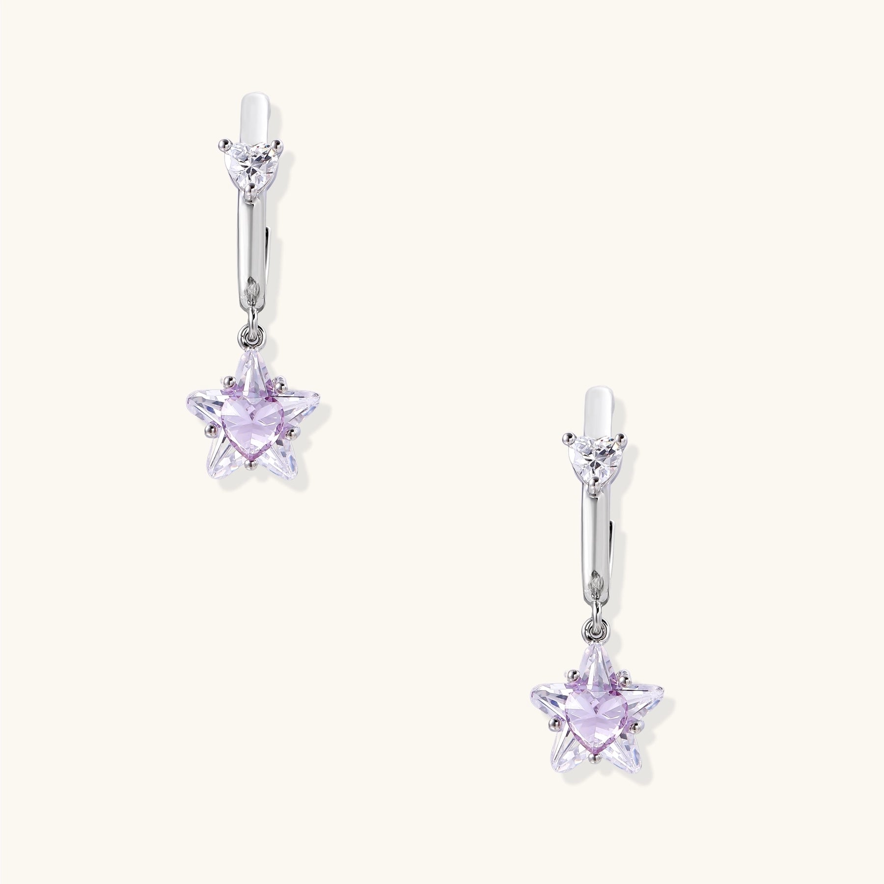 Drop earrings with purple star-shaped zirconia stones and clear teardrop accents in gold-plated brass setting