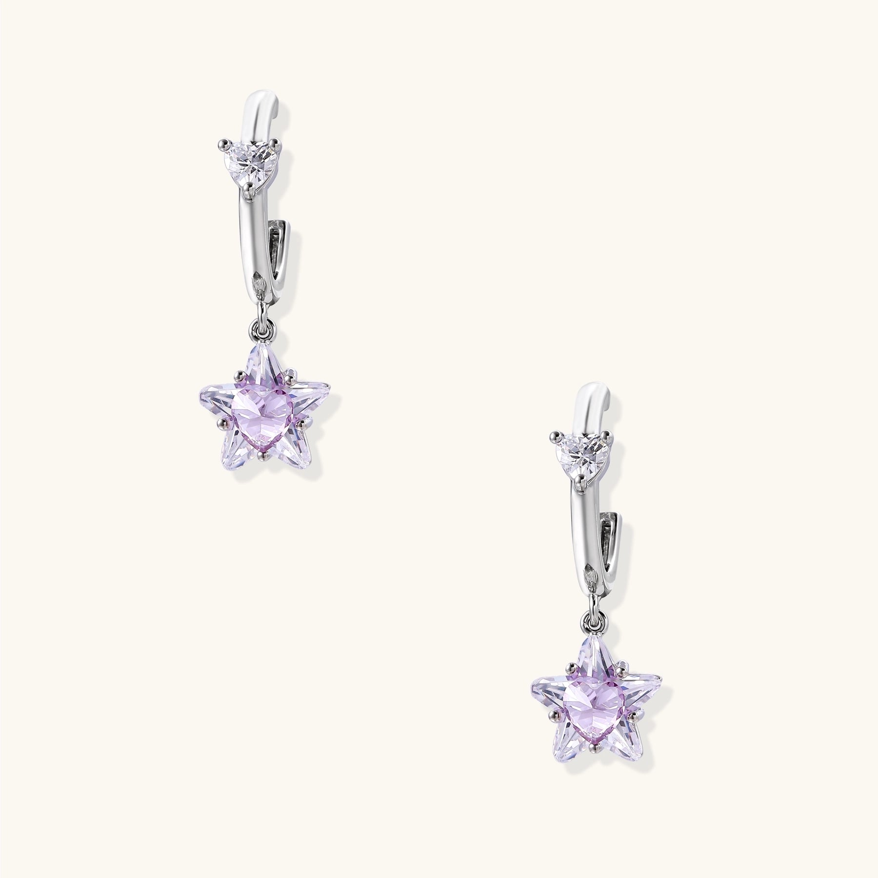 Drop earrings with purple star-shaped zirconia stones and clear teardrop accents in gold-plated brass setting