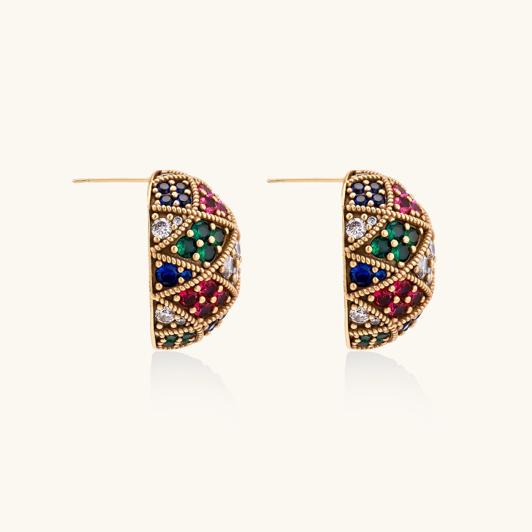 Oval gold-plated stud earrings with multicolor zirconia stones in geometric diamond pattern on white background.