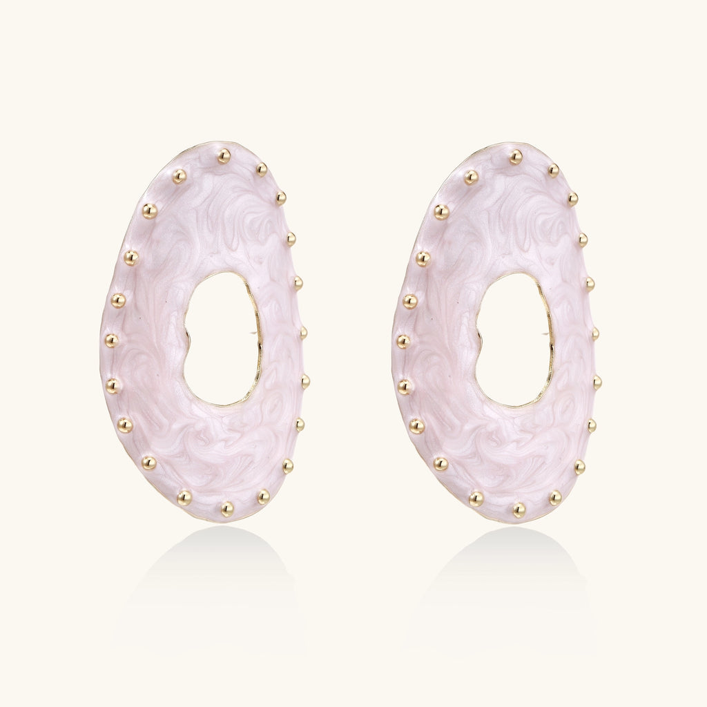 Oval lavender enamel earrings with gold studs around perimeter and cutout centers on white background
