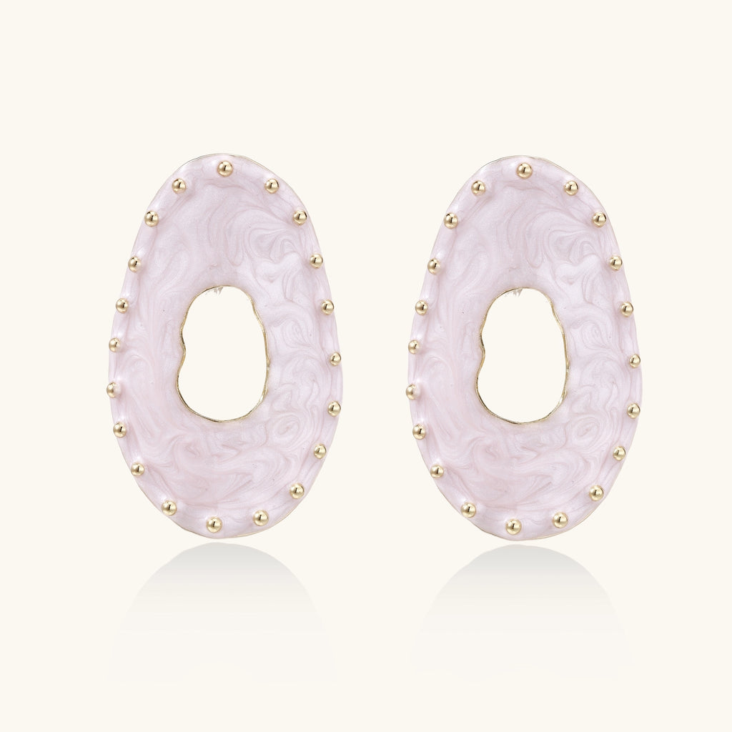 Oval lavender enamel earrings with gold studs around perimeter and cutout centers on white background
