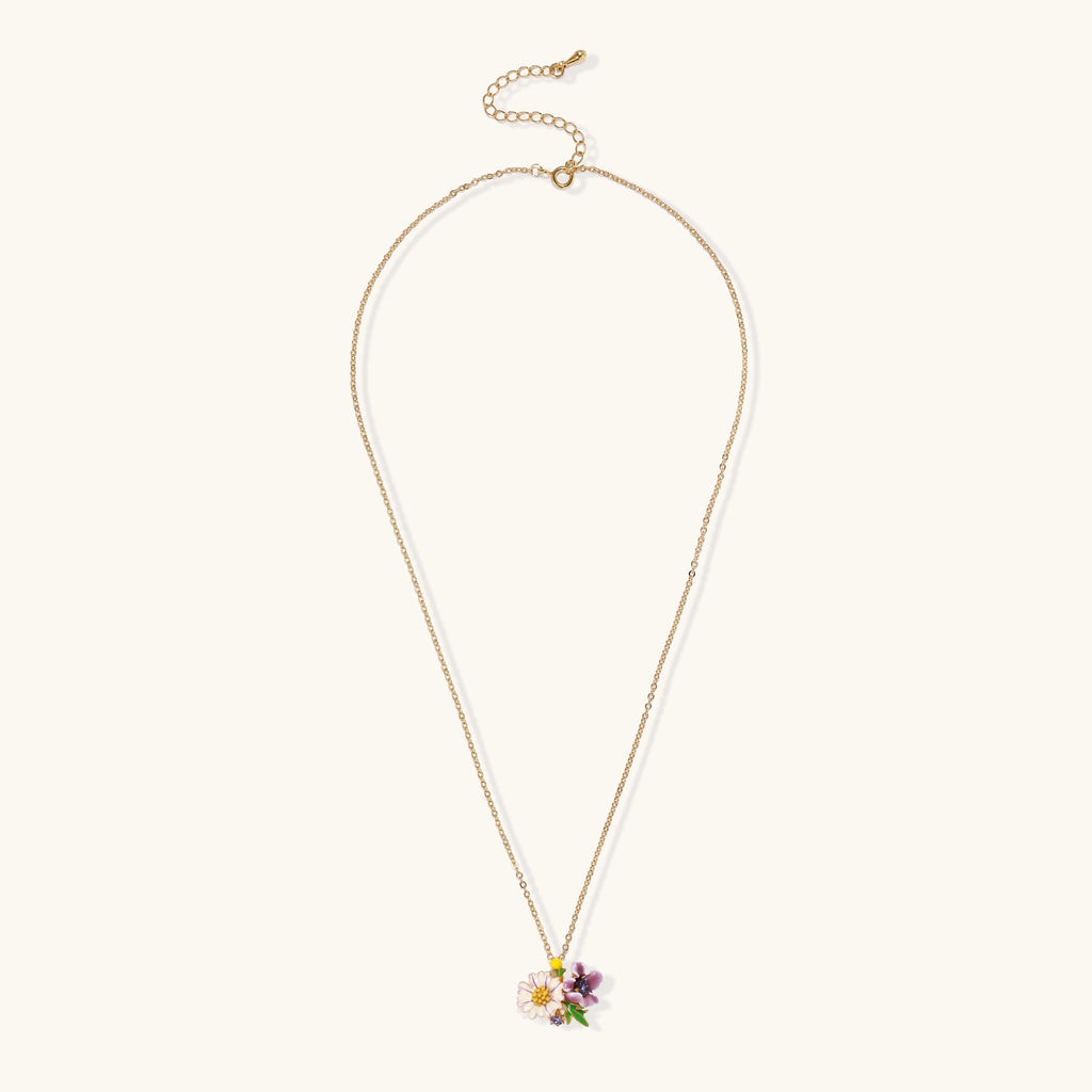 Delicate 18K gold plated necklace featuring colorful enamel flowers in pink and white with green leaves on chain