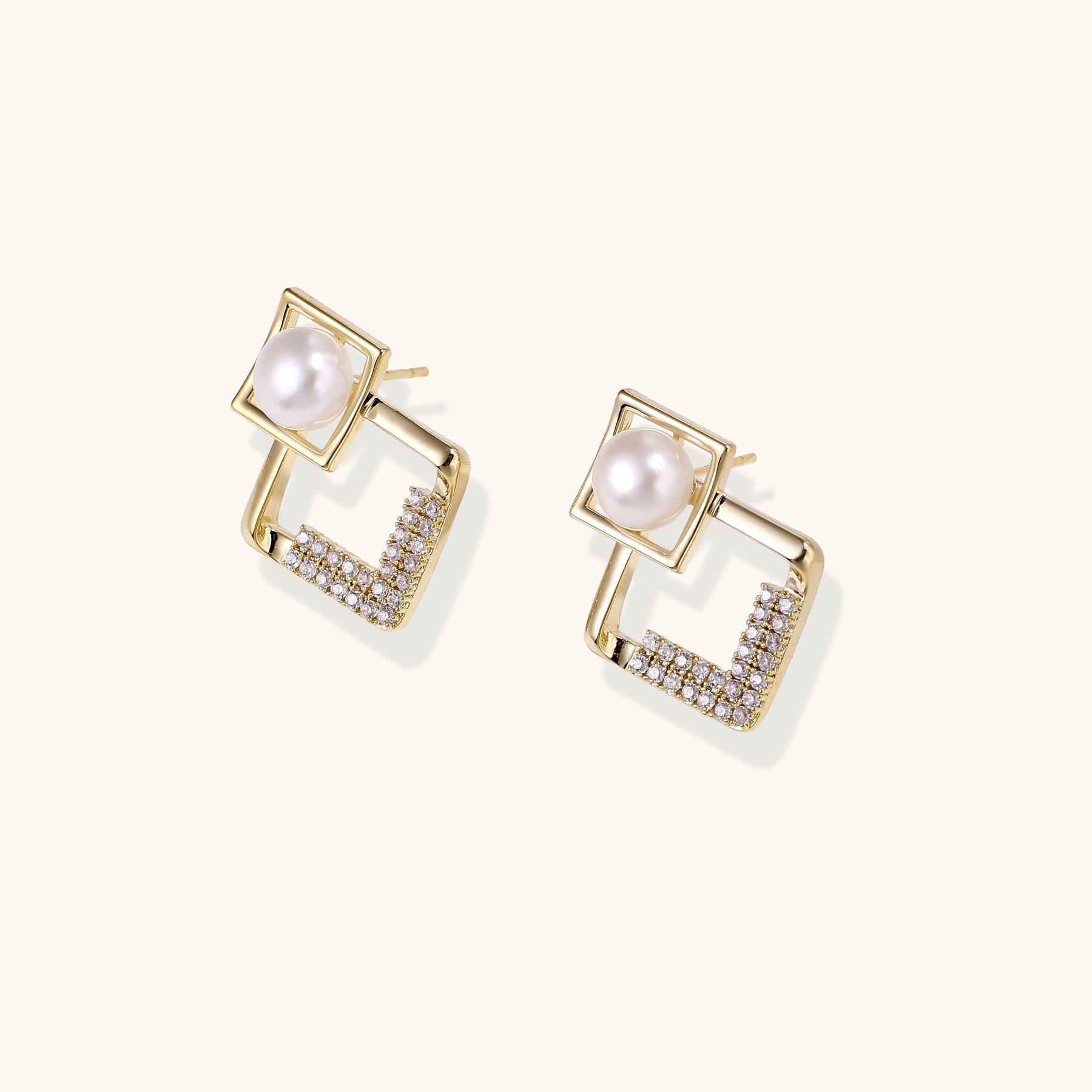 Gold-plated geometric drop earrings with freshwater pearls in square frames and crystal-accented diamond-shaped dangles