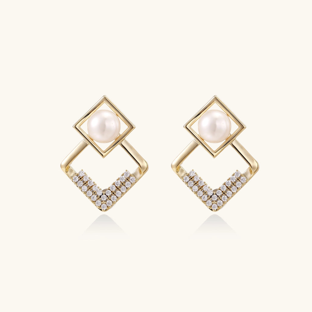 Gold-plated geometric drop earrings with freshwater pearls in square frames and crystal-accented diamond-shaped dangles