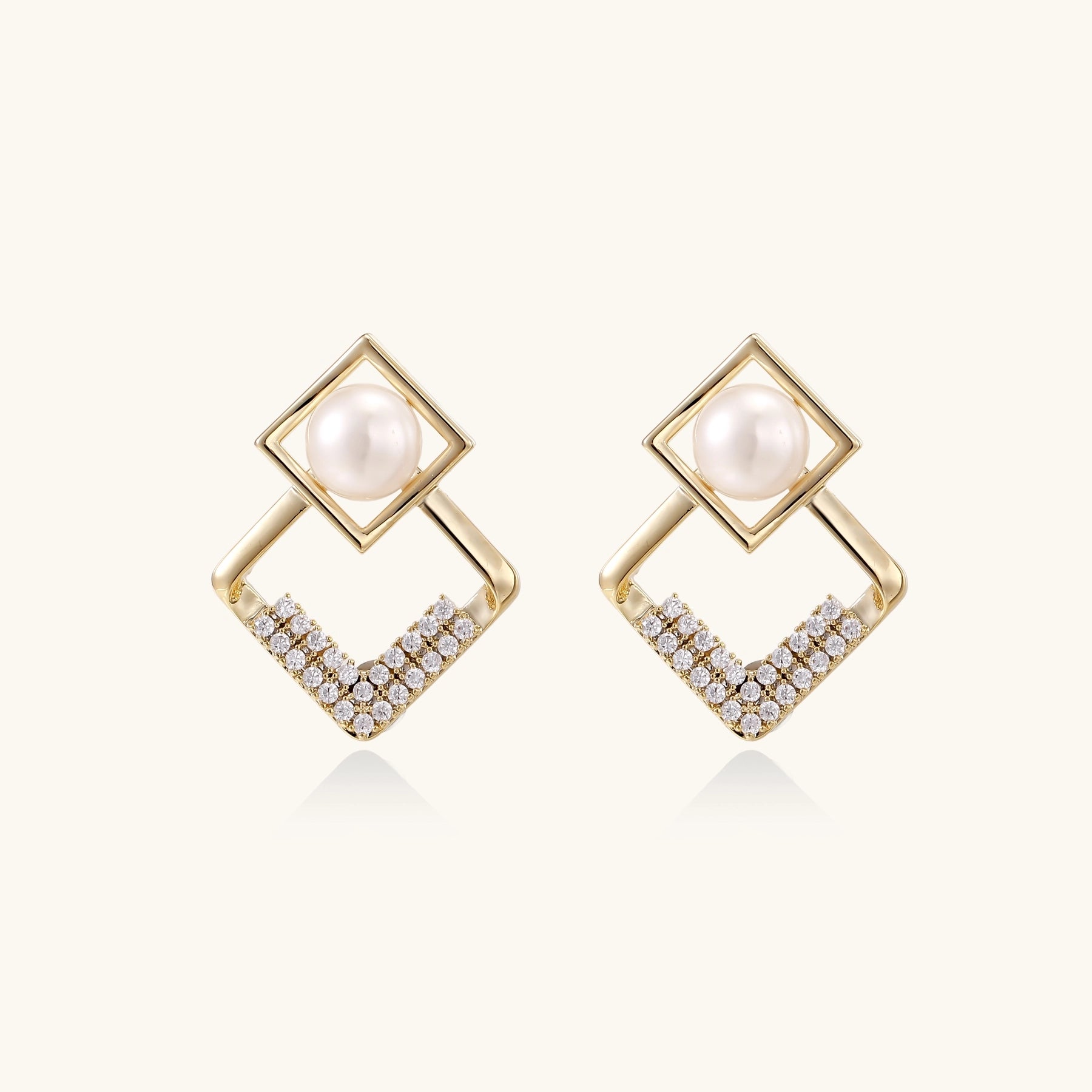 Gold-plated geometric drop earrings with freshwater pearls in square frames and crystal-accented diamond-shaped dangles