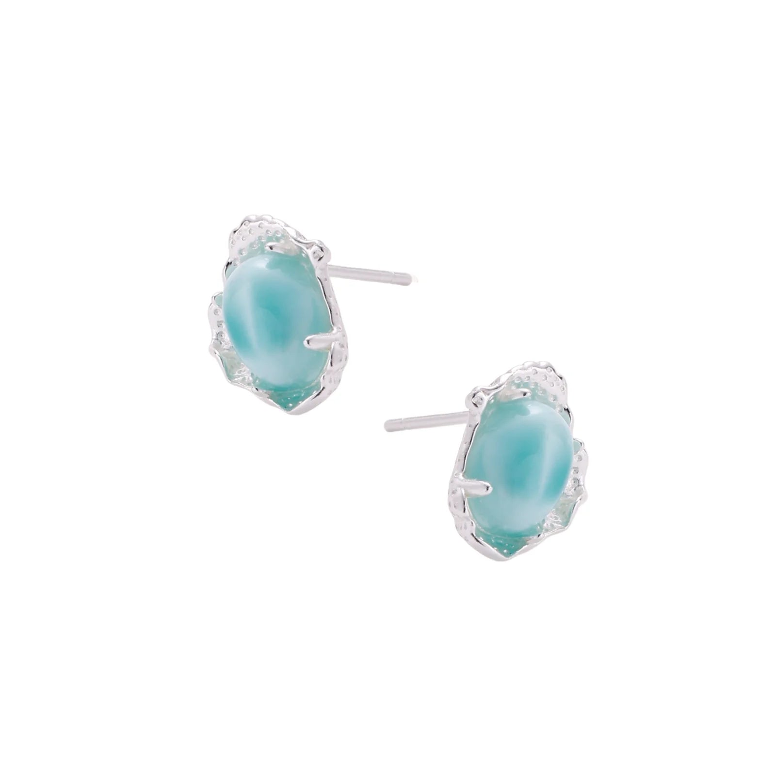 Oval larimar gemstone studs with ornate silver settings showing natural turquoise marbling on cream background