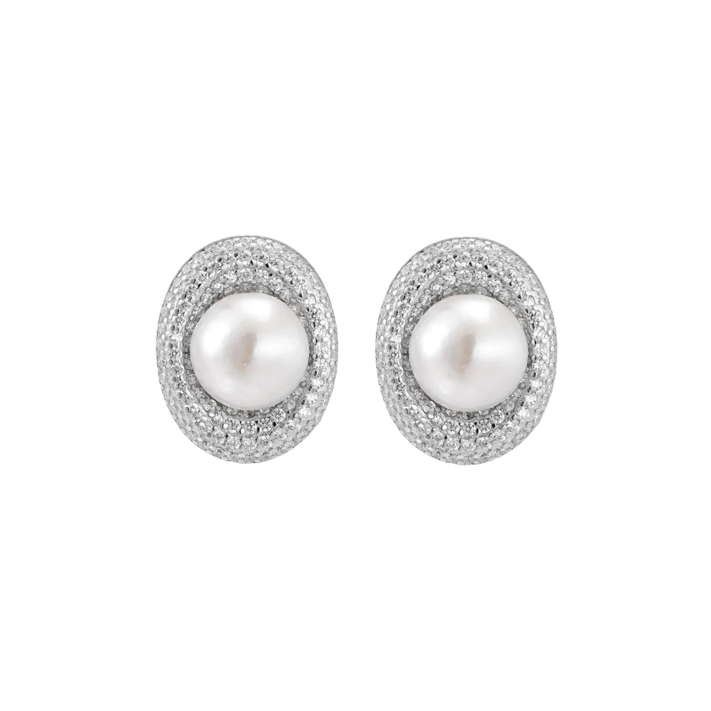 Oval rhodium-plated silver studs featuring freshwater pearls surrounded by pavé crystal halo on white background