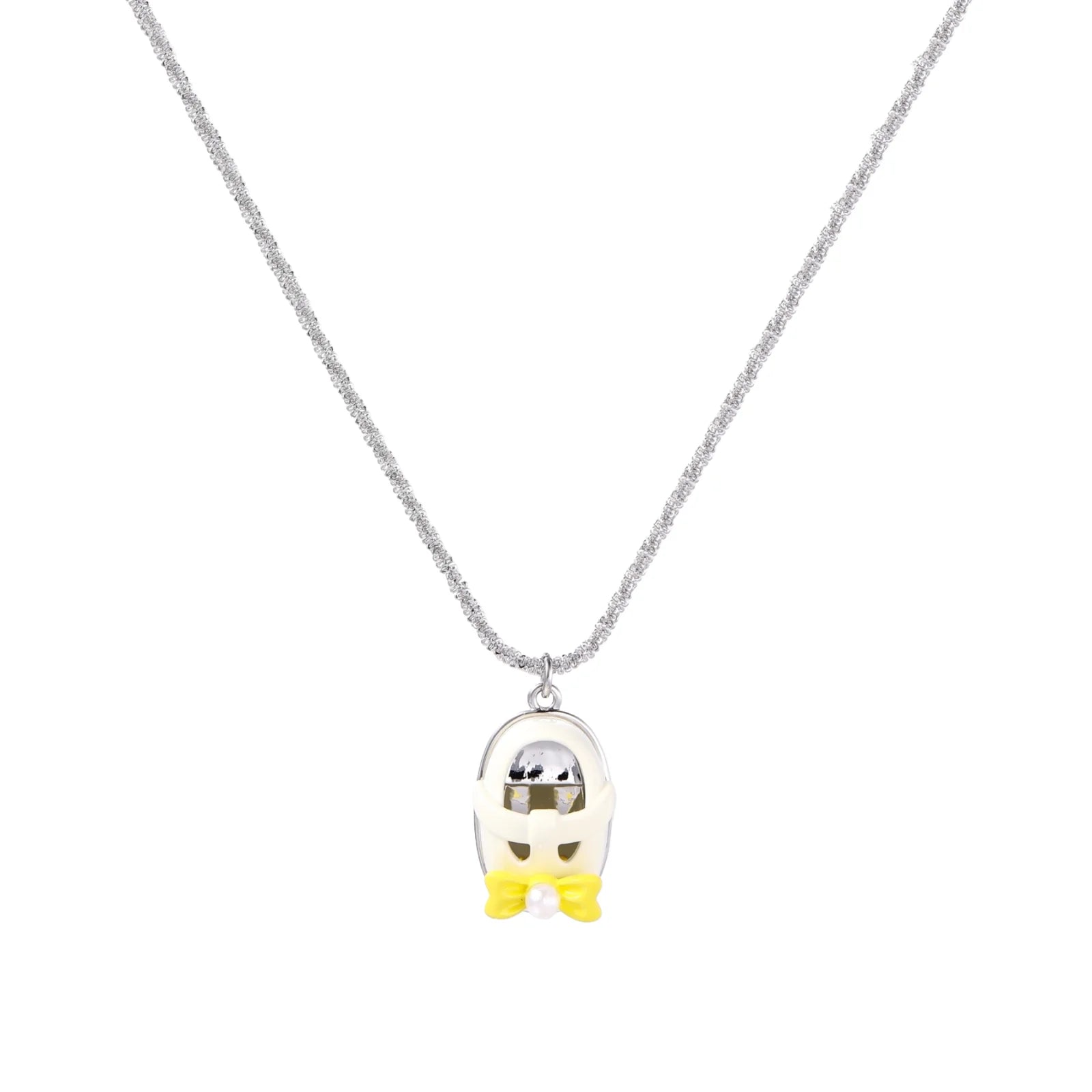 Chrome egg-shaped pendant with kawaii face, yellow bow, and pearl detail on silver chain against white background