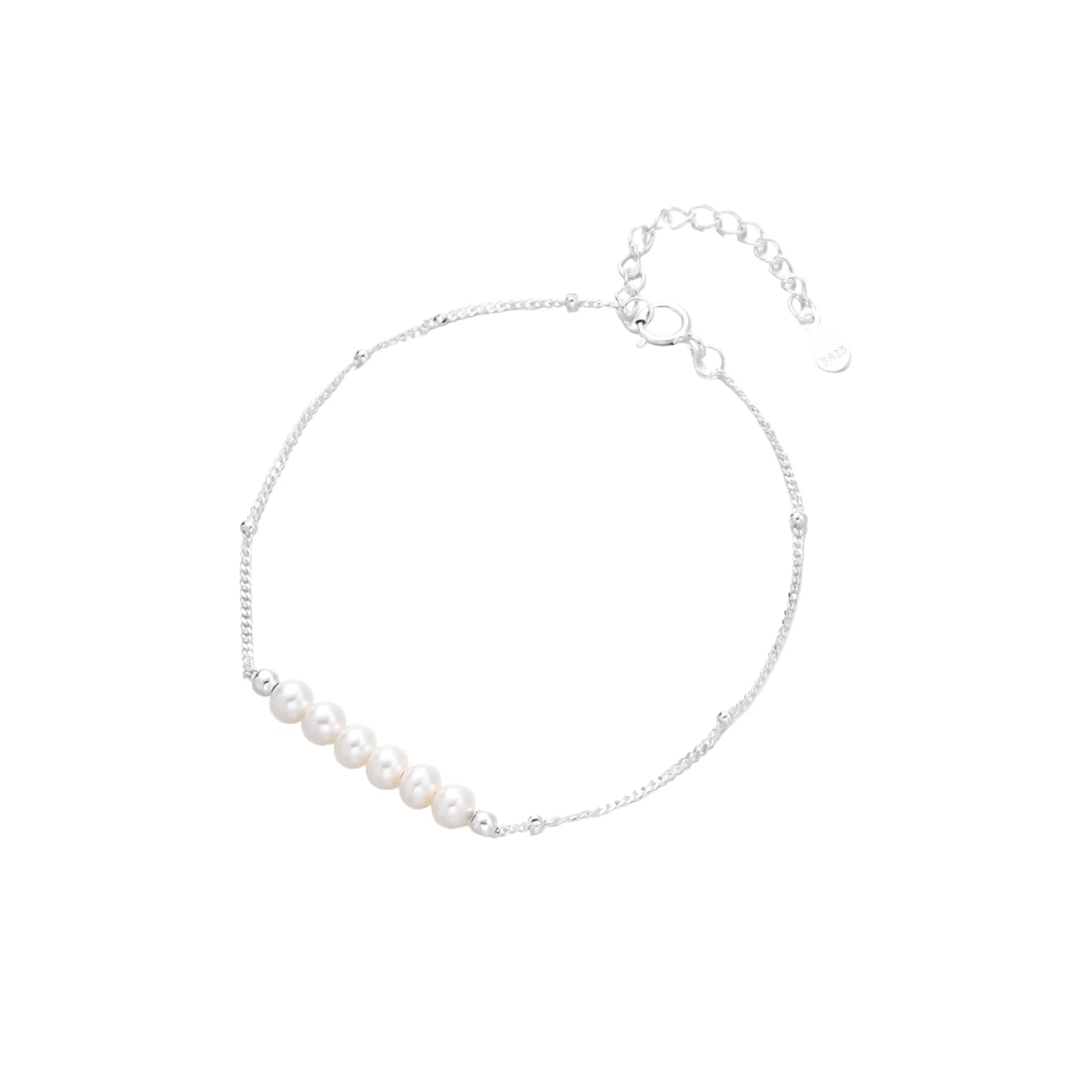Delicate rhodium-plated silver chain bracelet with row of small baroque pearls centered on white background.