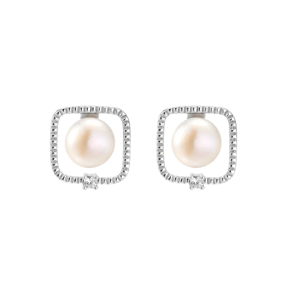 Rhodium-plated silver stud earrings with cushion frame, centered freshwater pearl, and tiny crystal accent
