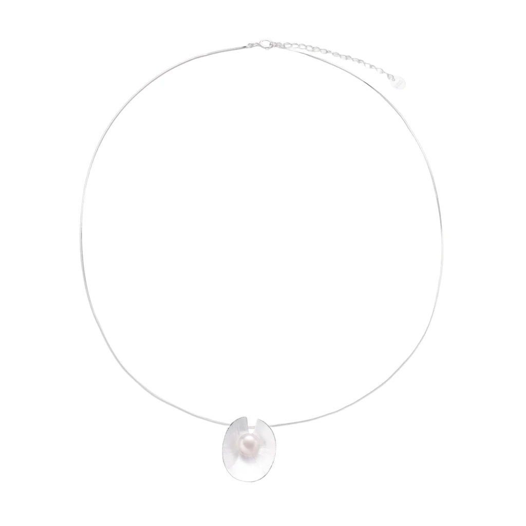 Sterling silver disc necklace with textured finish and centered freshwater pearl on delicate chain