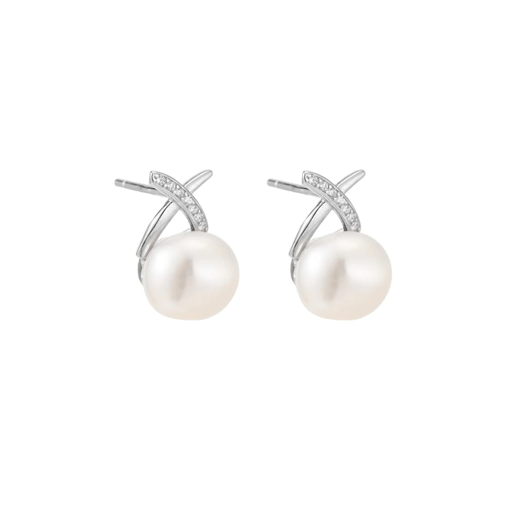 Rhodium-plated silver stud earrings with sparkling X design above lustrous round freshwater pearls on white background.