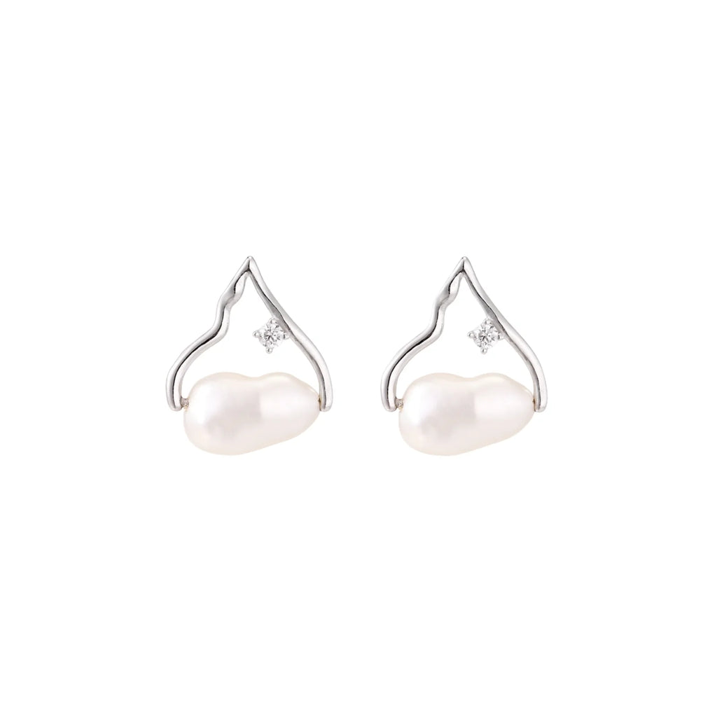 Silver mountain outline studs with baroque pearl and diamond accent on white background