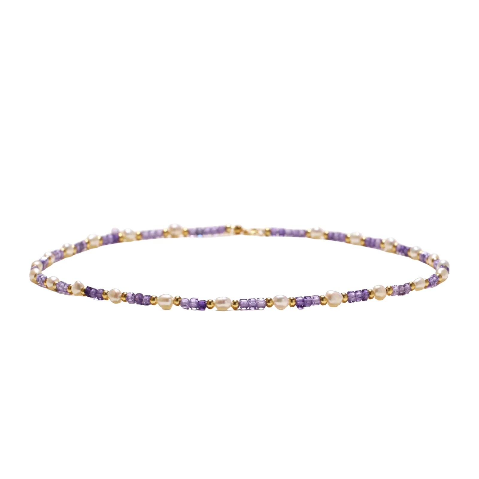 Delicate 18K gold vermeil necklace with alternating lavender zirconia beads and white freshwater pearls on cream background